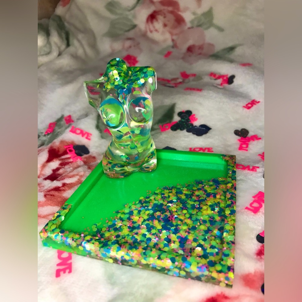 Handmade resin goddess jewelry tray in neon green with sparkly confetti
